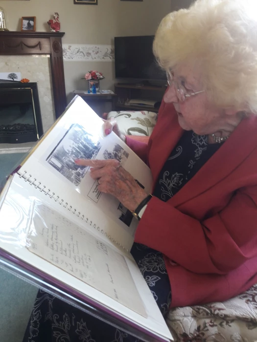 1 leafing through an album doriss parents left her  depicting the chapels seminal moments