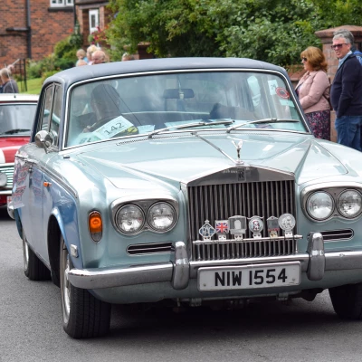 a rolls royce silver shadow in the parade through audlem
