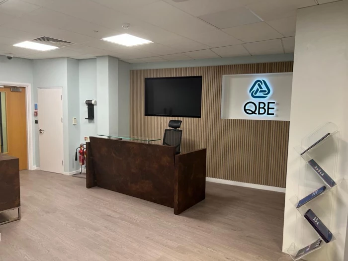 approaching the new reception area at the qbe offices in leeds