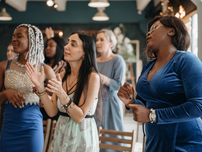 A Group of Women Singing Together