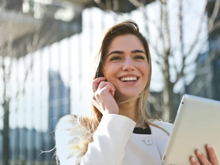 Woman In White Blazer Holding Tablet Computer