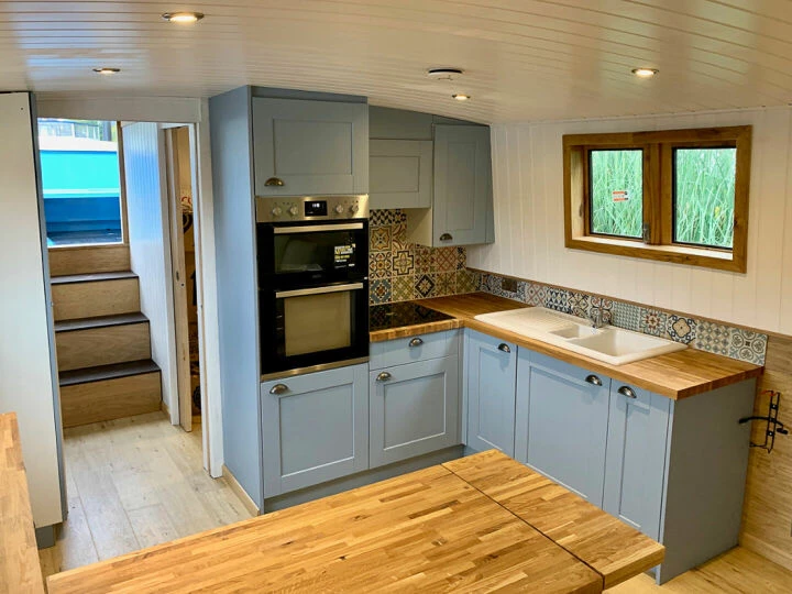 Interior of a solar-powered boat kitchen area with oven