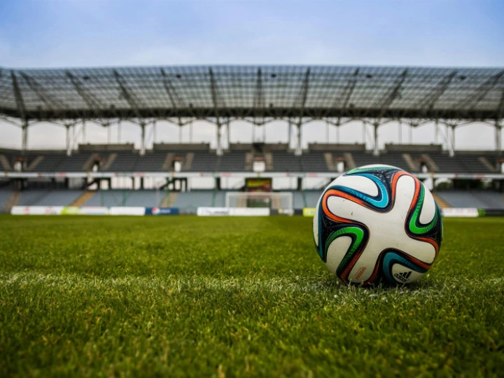 Soccer Ball on Grass Field during Daytime