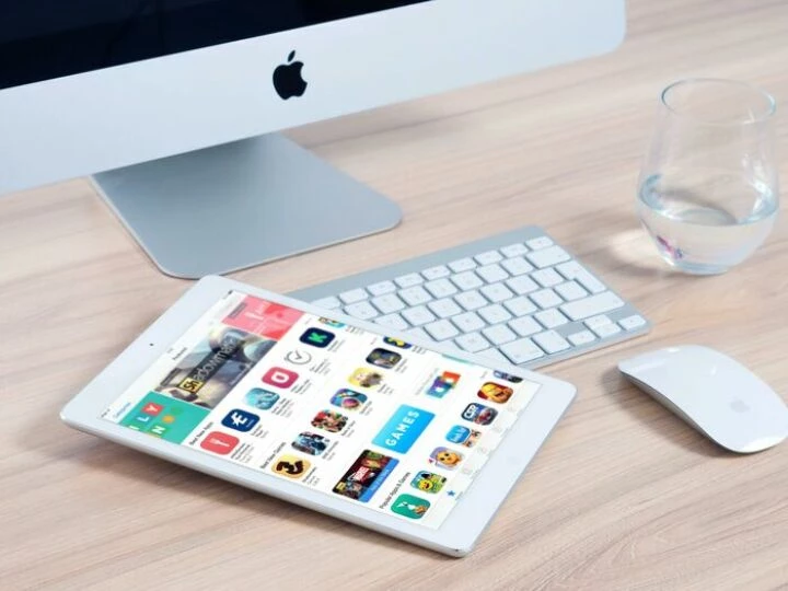 White Tablet Computer On Apple Magic Keyboard Near