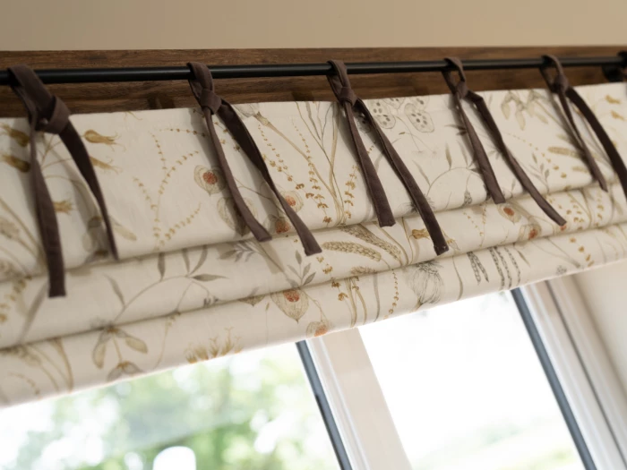 Roman blinds with ribbons