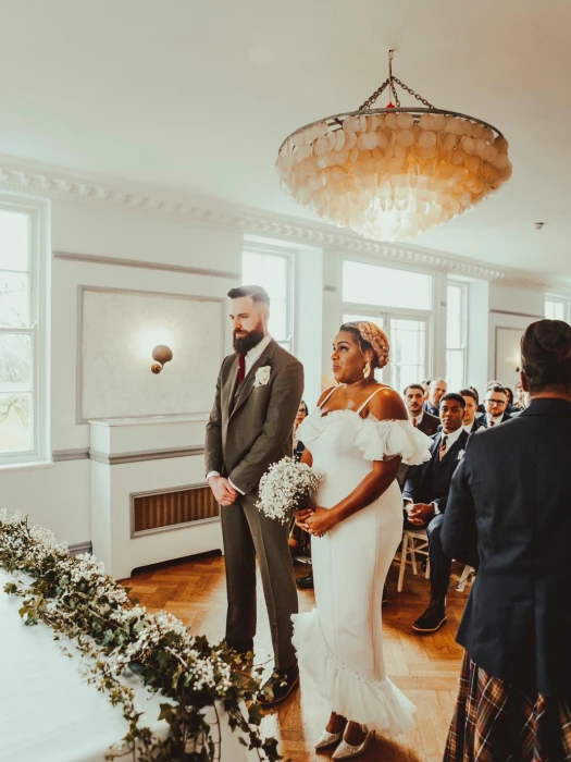 bride at alter in pink dress
