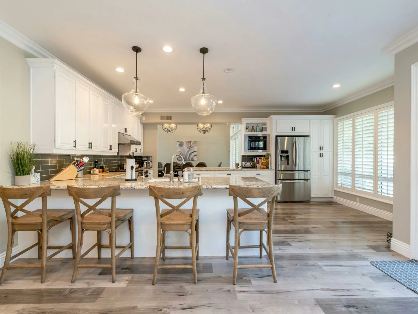 bright and spacious kitchen interior featuring bar stools and modern design elements