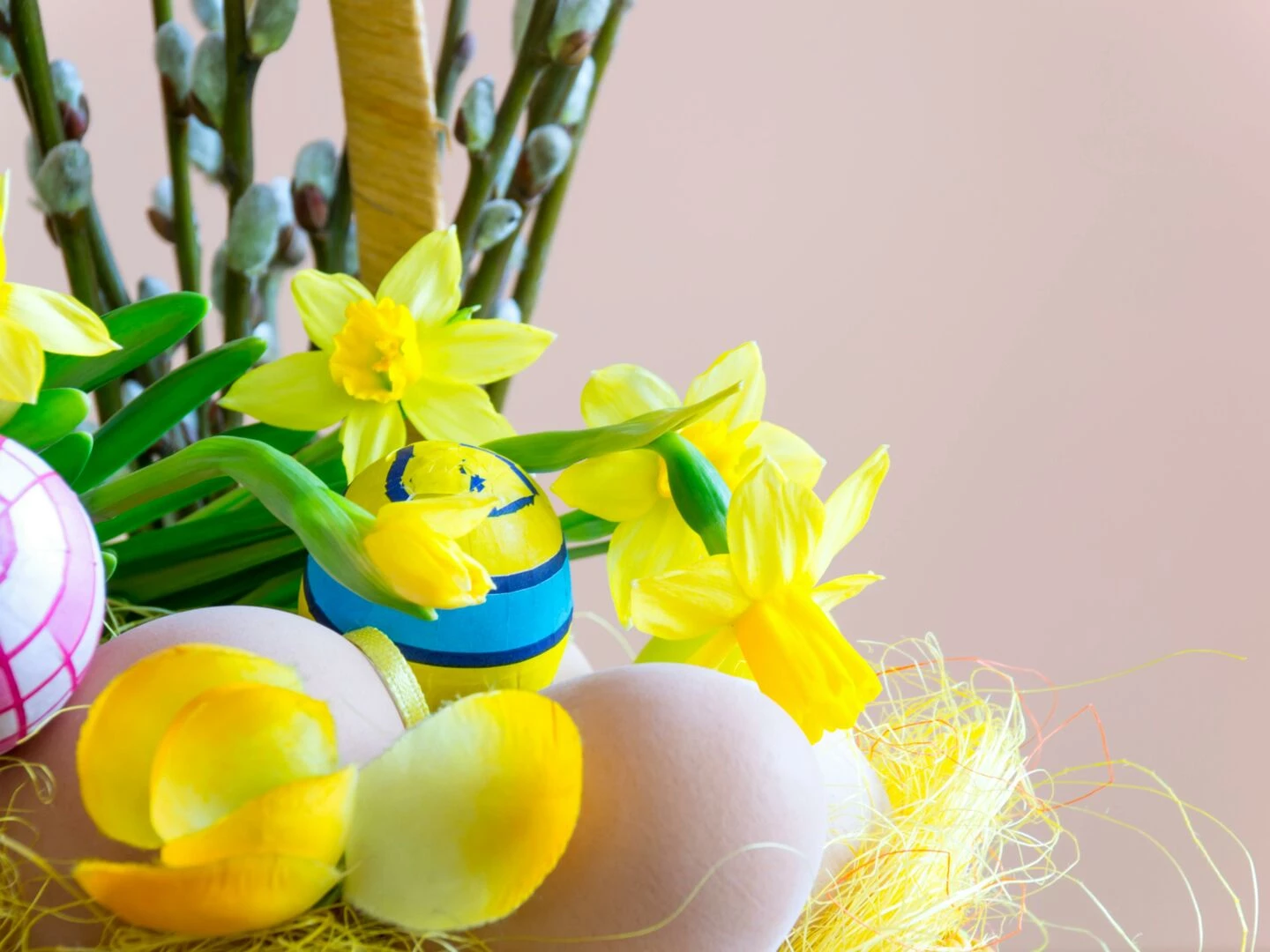 bright easter scene with decorated eggs and blooming daffodils creating a festive spring atmosphere
