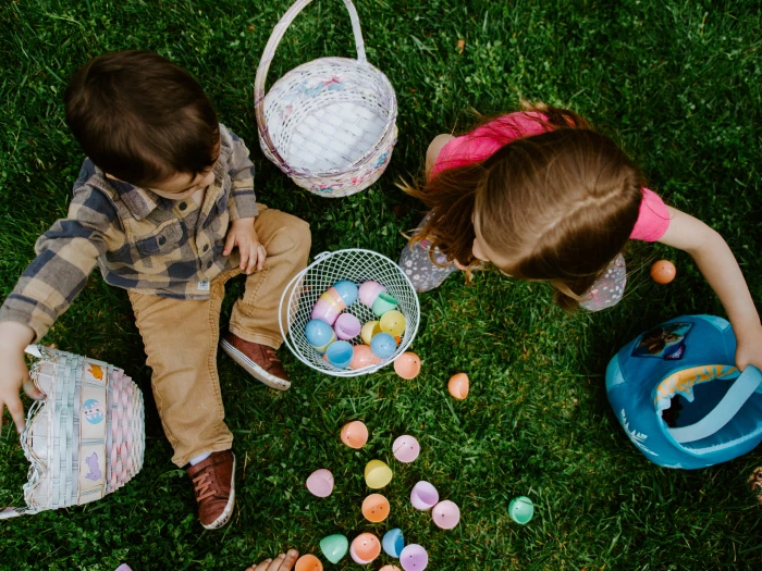 child-adult-eggs-easter-flowers