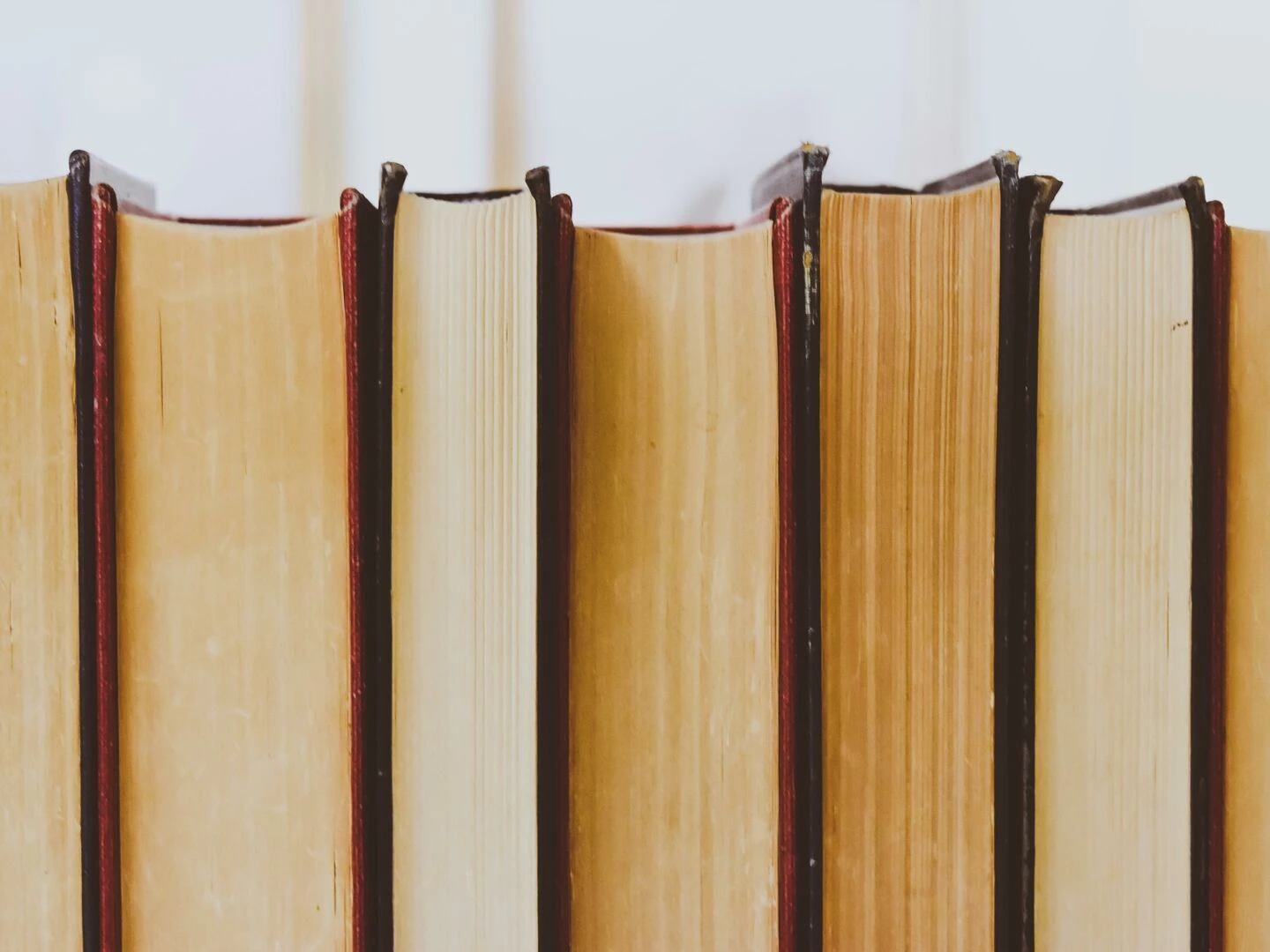 closeup view of vintage book bindings in a library setting