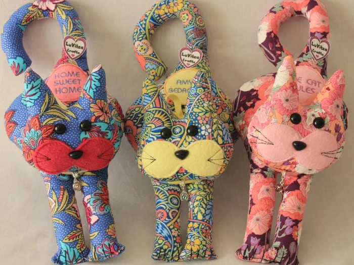 door hanging cats