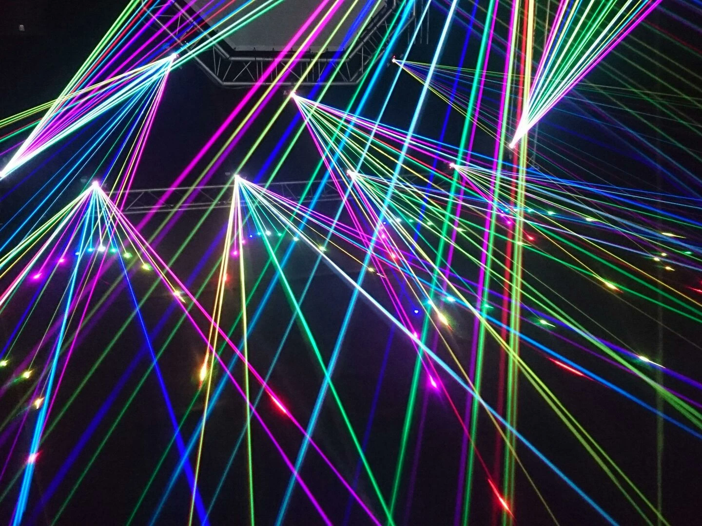dynamic multicolor laser beams create an electrifying display in a nighttime laser show