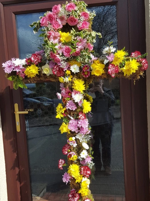 easter 16 cross with flowers outside church