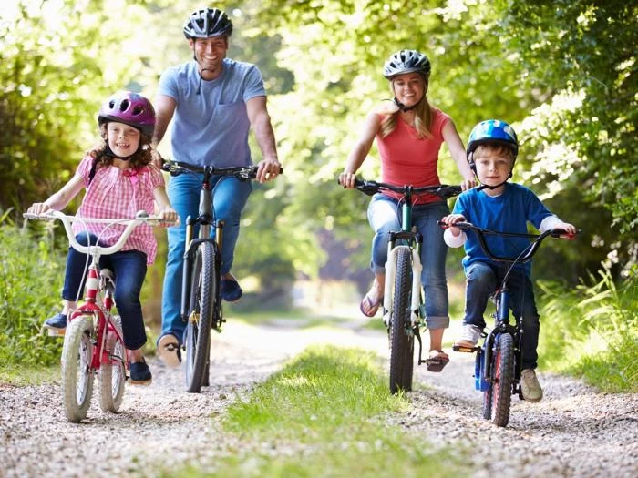 family on cycle ride in countryside