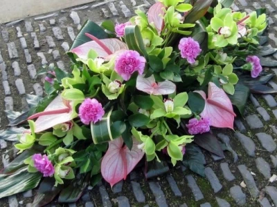 funeral flowers sympathy casket flowers pink green