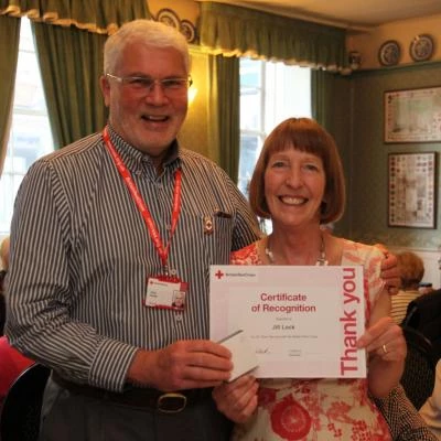 langport red cross jill lock receives her long service award from chris davies  somerset president