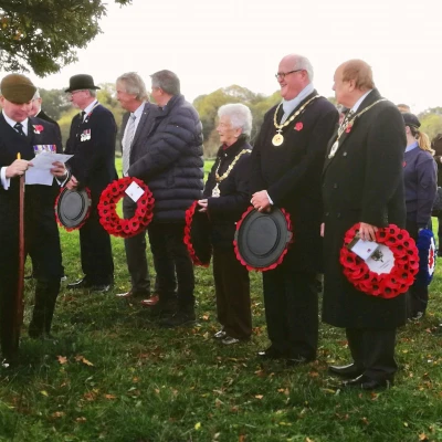 local dignitaries waiting to lay wreaths in respect