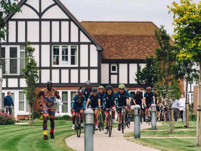mr m and cyclists in village