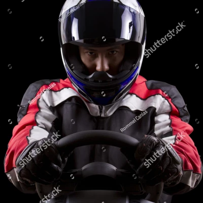stock photo racerwearing red racing suit and blue helmet on a steering wheel 162914456