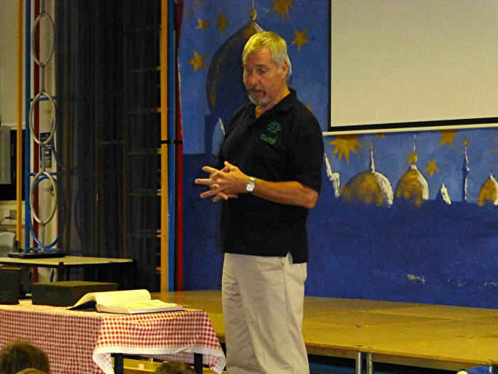 stuart in a school assembly   presentation of jim grogan award