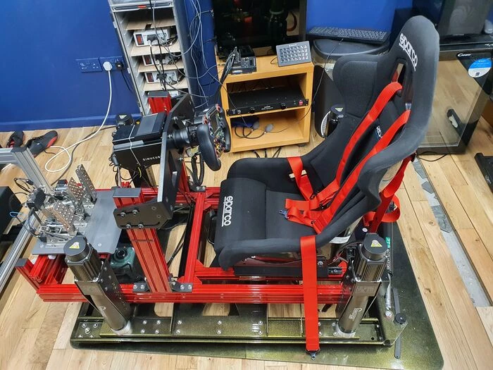 view of a motion rig platform with a black cockpit seat
