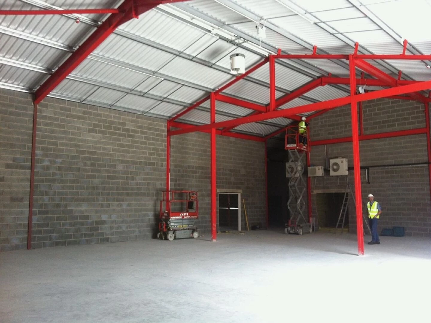 warehouse construction with red steel frame