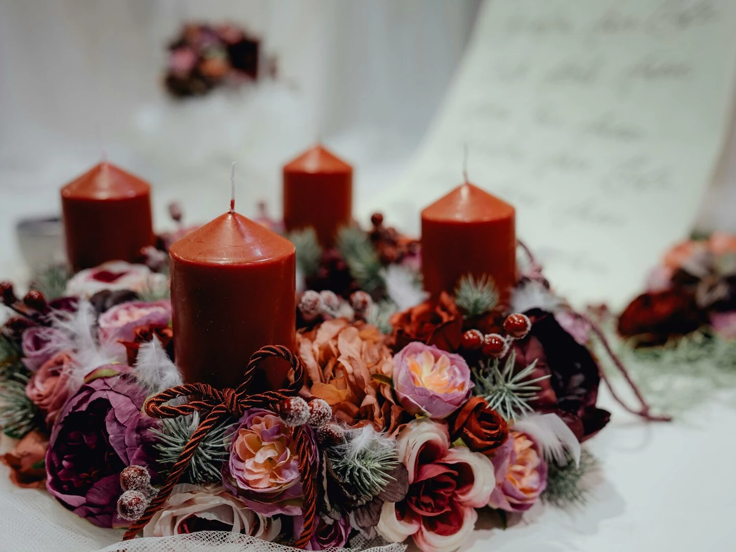 warm festive candle wreath adorned with floral decorations perfect for christmas table settings