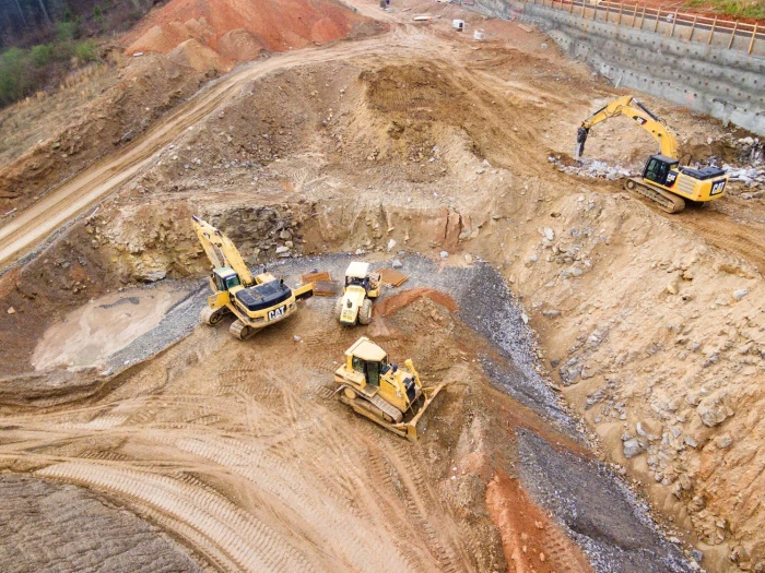 yellow diggers on a construction site