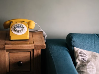 yellow phone on a table